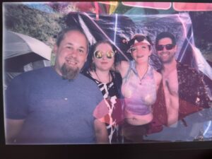 Polaroid-style photo of four smiling Pickleodeon camp members posing together